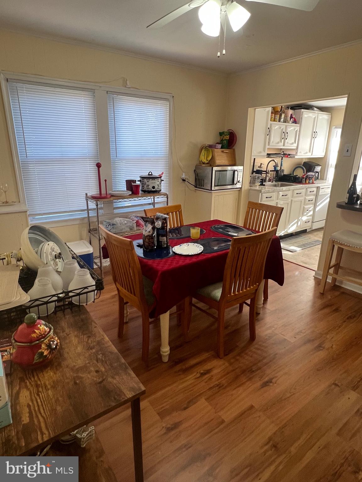 24691 Old 3 Notch Road Hollywood, MD 20636 - Photo 3 of 6 a view of a dining room with furniture and wooden floor