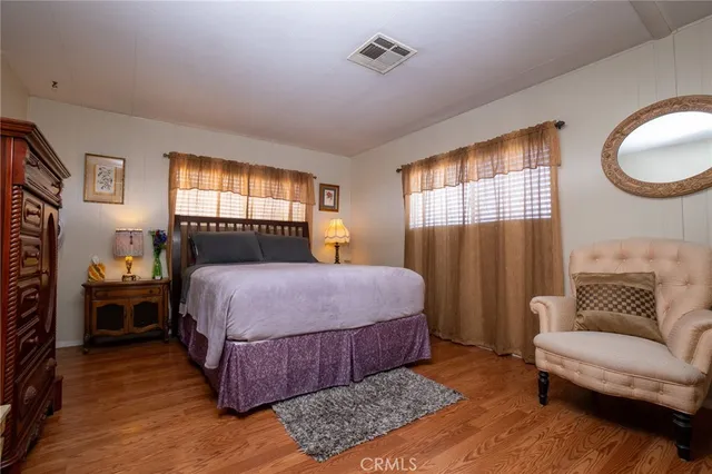 a bedroom with a bed and a couch