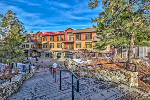 a view of a house with backyard porch and sitting area