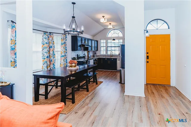 a view of a livingroom with furniture and window