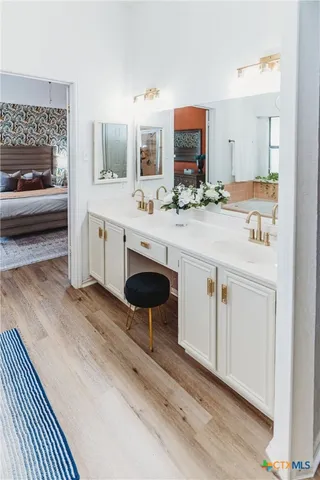 a kitchen with stainless steel appliances a sink stove and cabinets