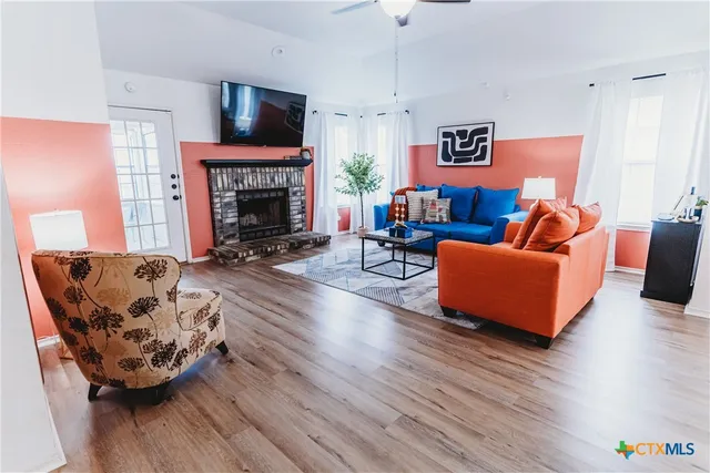 a living room with furniture and a fireplace