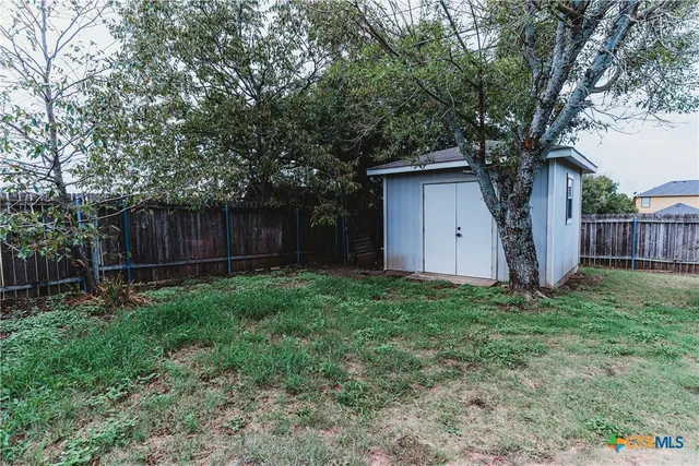 a house with a tree in front of it