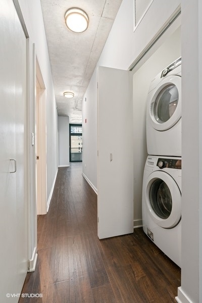 235 West Van Buren Street, Unit 1622 Chicago, IL 60607 - Photo 19 of 29 a view of a hallway with washer and dryer