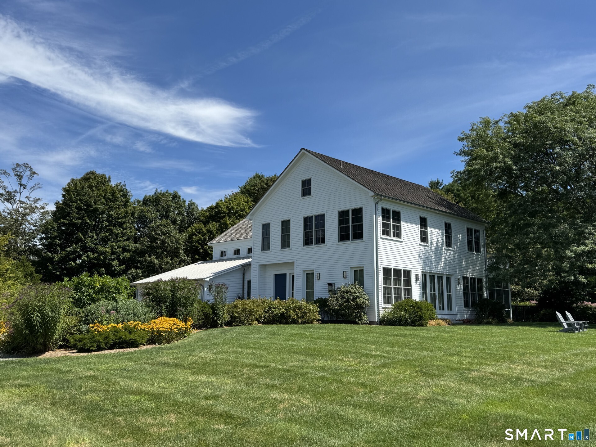 79 East Street Washington, CT 06793 - Photo 1 of 40 a front view of a house with a yard