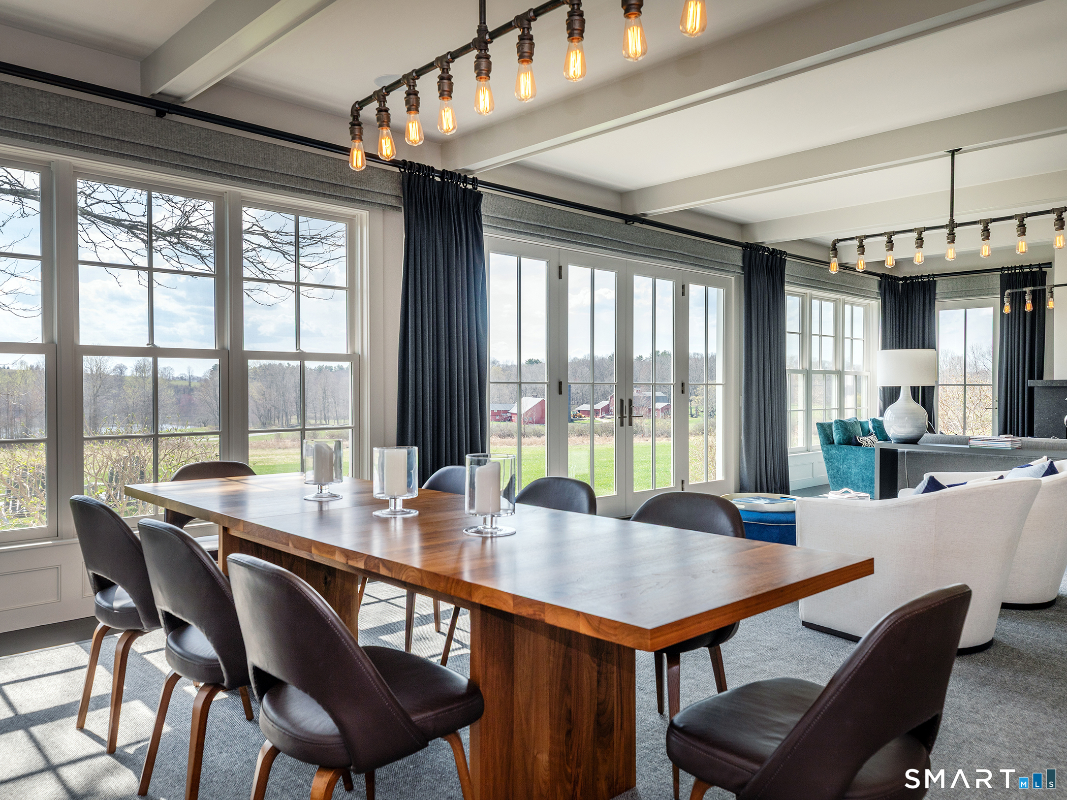 79 East Street Washington, CT 06793 - Photo 15 of 40 a view of a dining room with furniture large windows and wooden floor