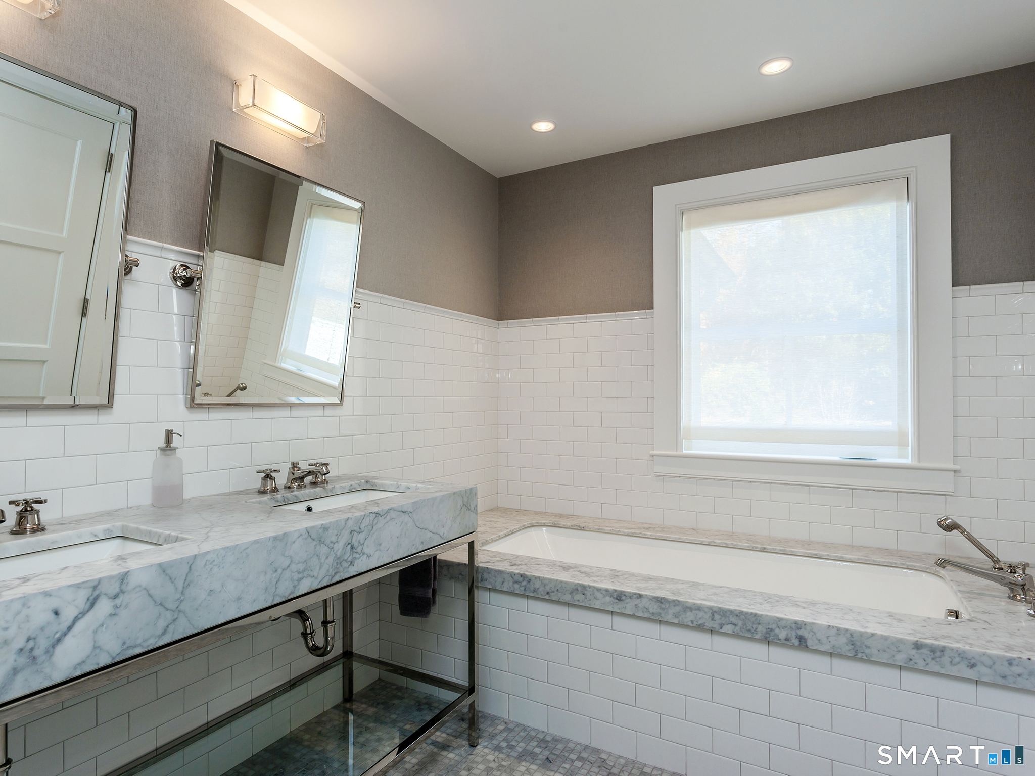 79 East Street Washington, CT 06793 - Photo 25 of 40 a bathroom with a granite countertop bathtub sink vanity and mirror