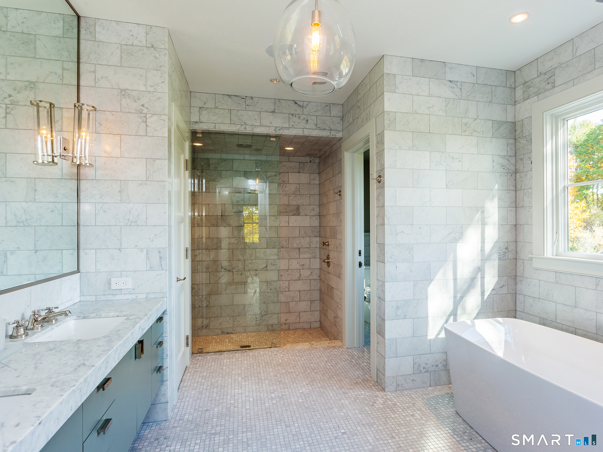 79 East Street Washington, CT 06793 - Photo 30 of 40 a bathroom with a granite countertop sink a toilet and shower