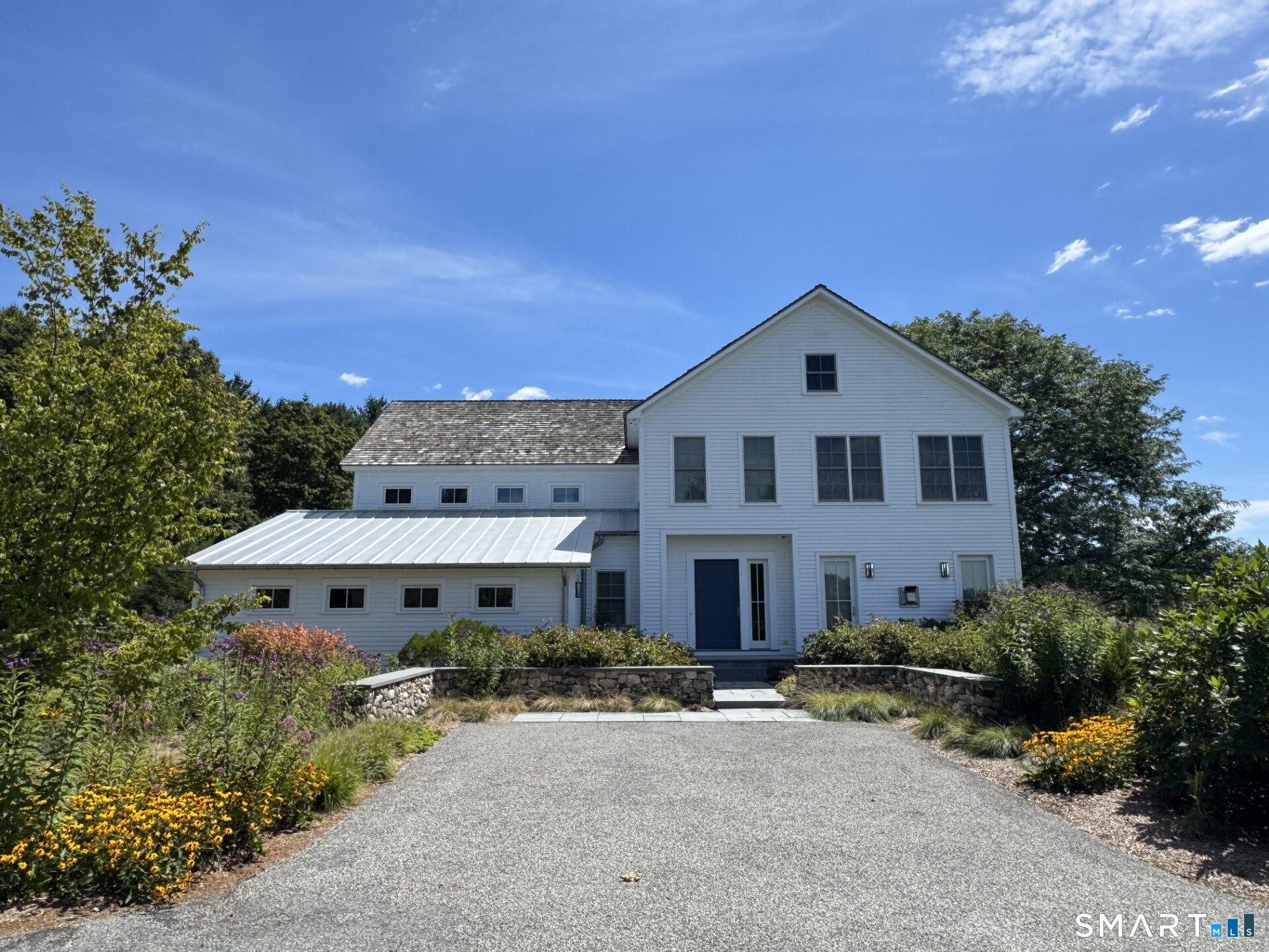 79 East Street Washington, CT 06793 - Photo 3 of 40 a front view of a house with a yard