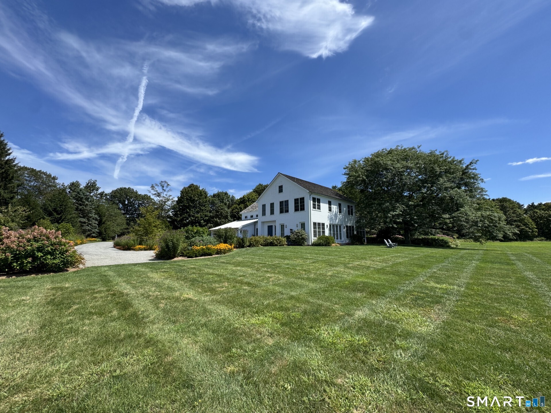 79 East Street Washington, CT 06793 - Photo 5 of 40 a front view of a house with a yard