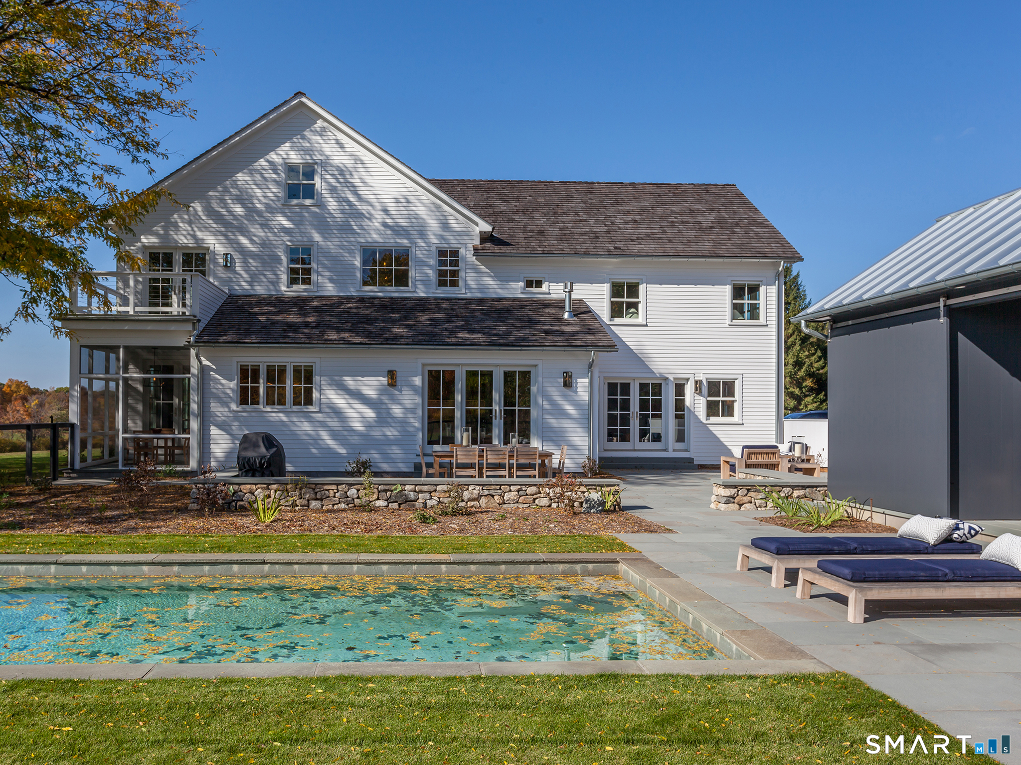 79 East Street Washington, CT 06793 - Photo 7 of 40 a view of a house with swimming pool and sitting area