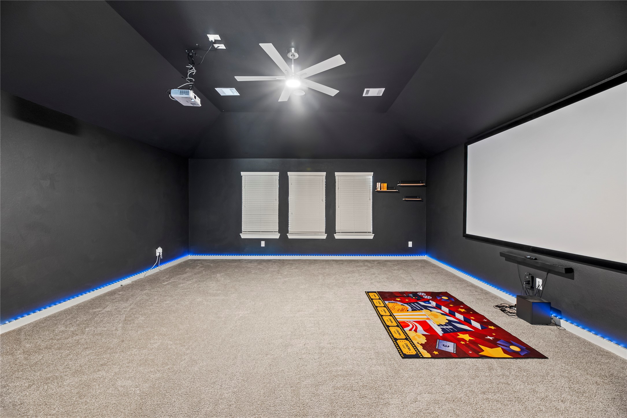 1600 Del Sol Rdg Lane Katy, TX 77493 - Photo 14 of 28 Located on the second floor, the media room offers a spacious layout with a projector and screen, making it a comfortable spot for movie nights.