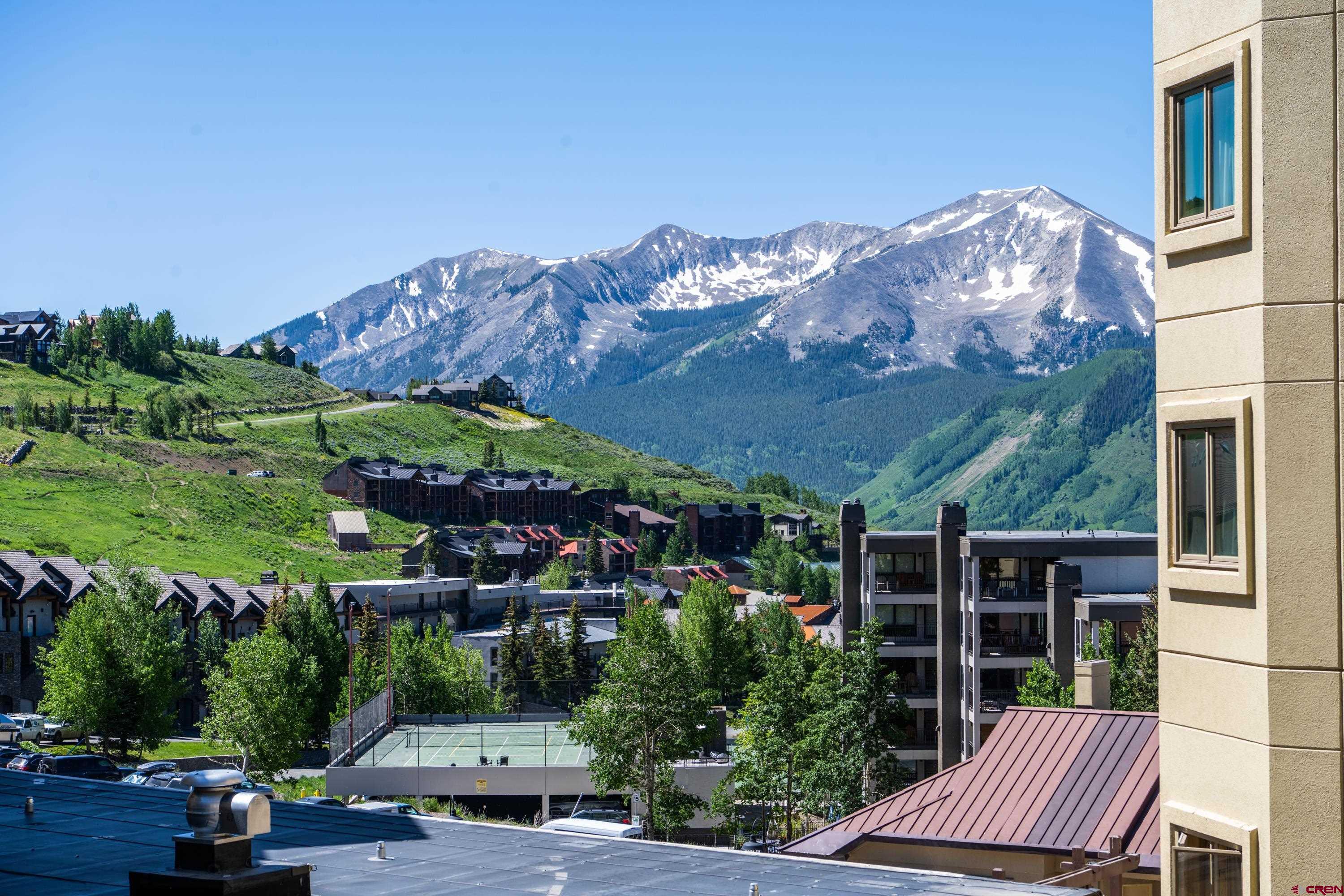 500 Gothic Road, Unit 322 Crested Butte, CO 81225 - Photo 19 of 22 a view of a patio with furniture and a garden