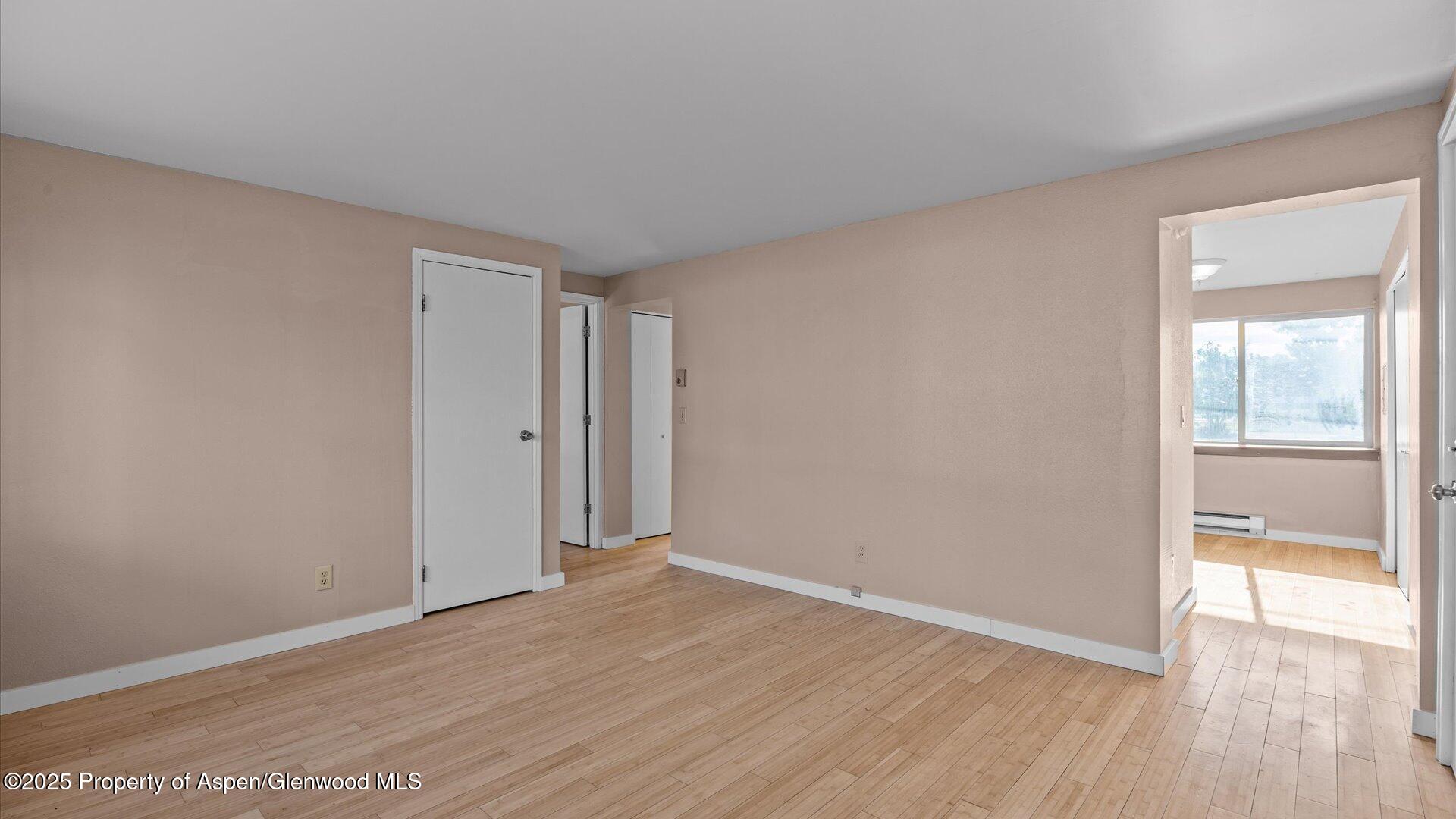 1014 Stillwell Avenue Rifle, CO 81650 - Photo 8 of 13 a view of an empty room with wooden floor