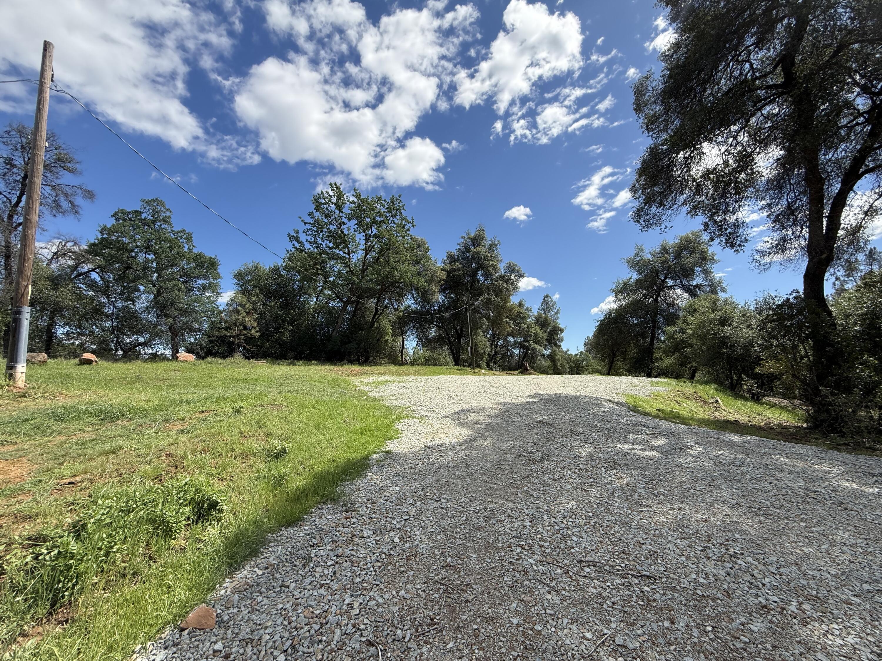 12333 Quartz Hill Road Redding, CA 96003 - Photo 14 of 21 a view of outdoor space with green field and trees