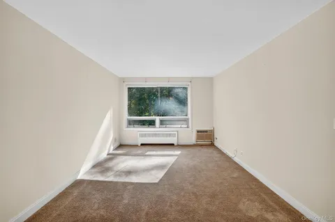 a view of a room with a large window