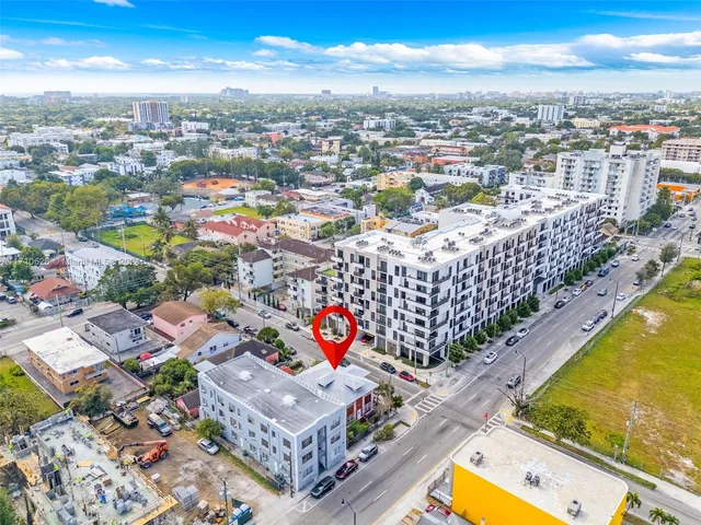 an aerial view of residential building with parking space