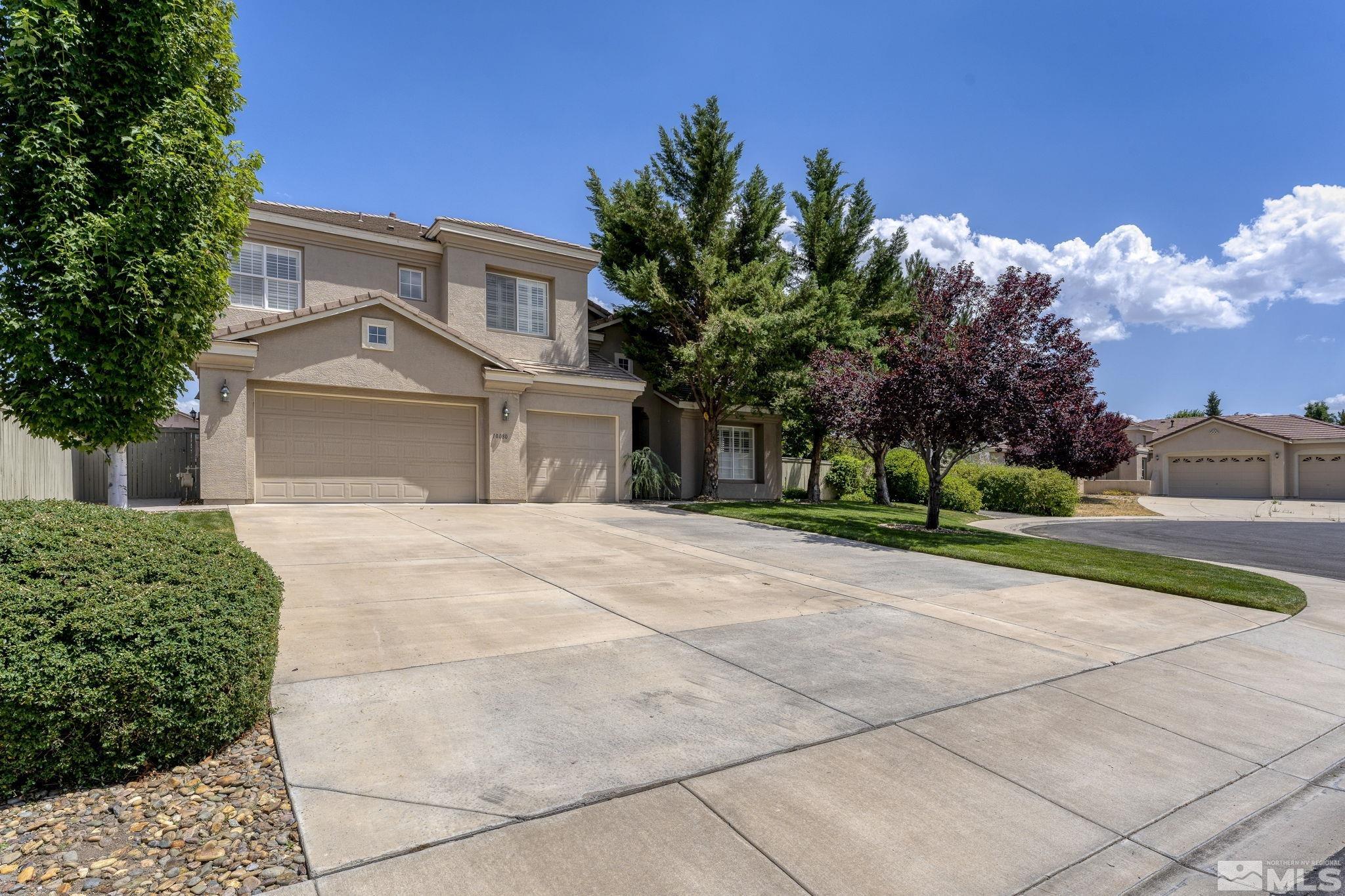 10080 Goler Wash Court Reno, NV 89521 - Photo 1 of 40 a front view of a house with a yard and trees