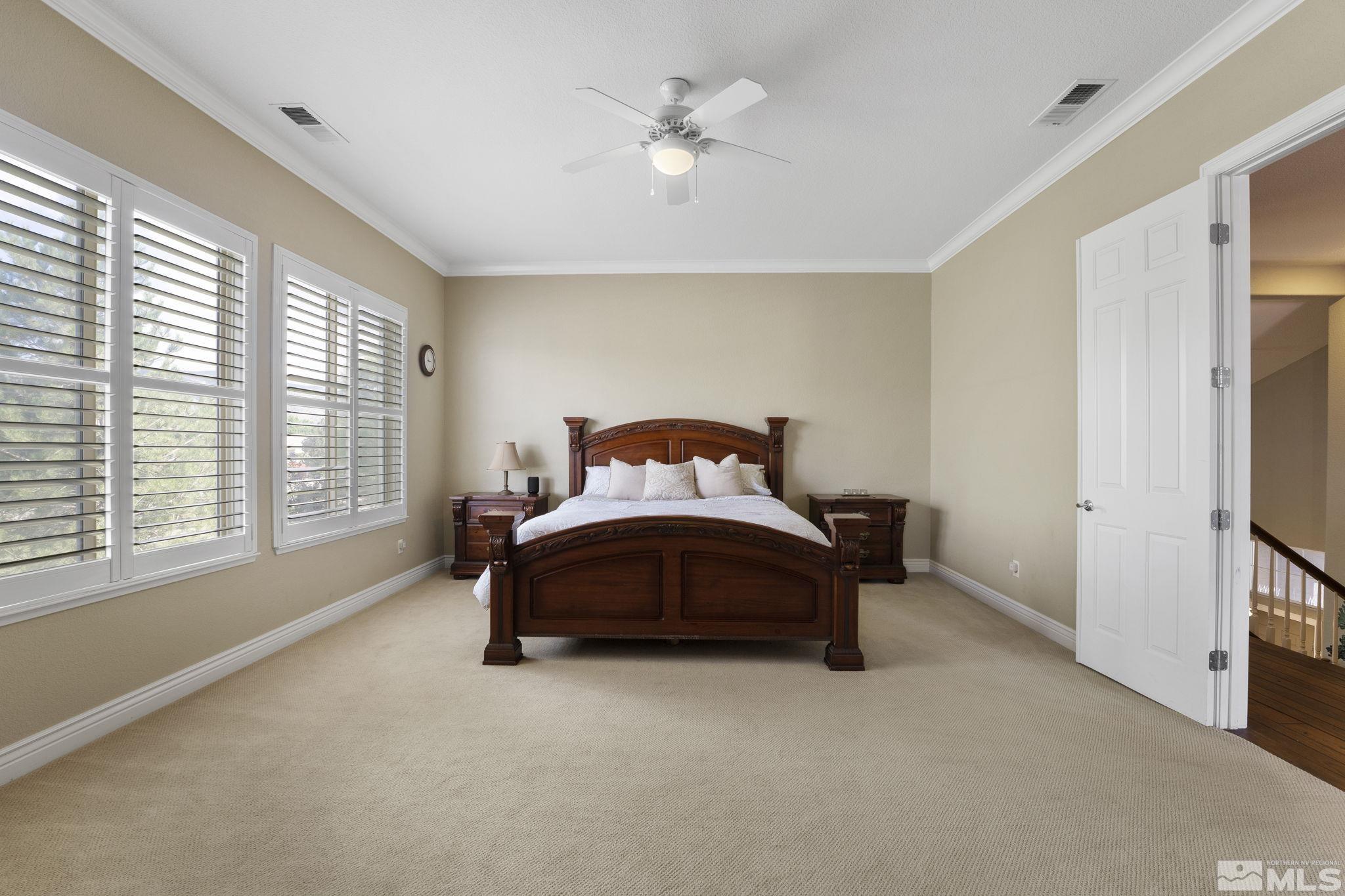 10080 Goler Wash Court Reno, NV 89521 - Photo 20 of 40 a bedroom with a bed dresser and a window