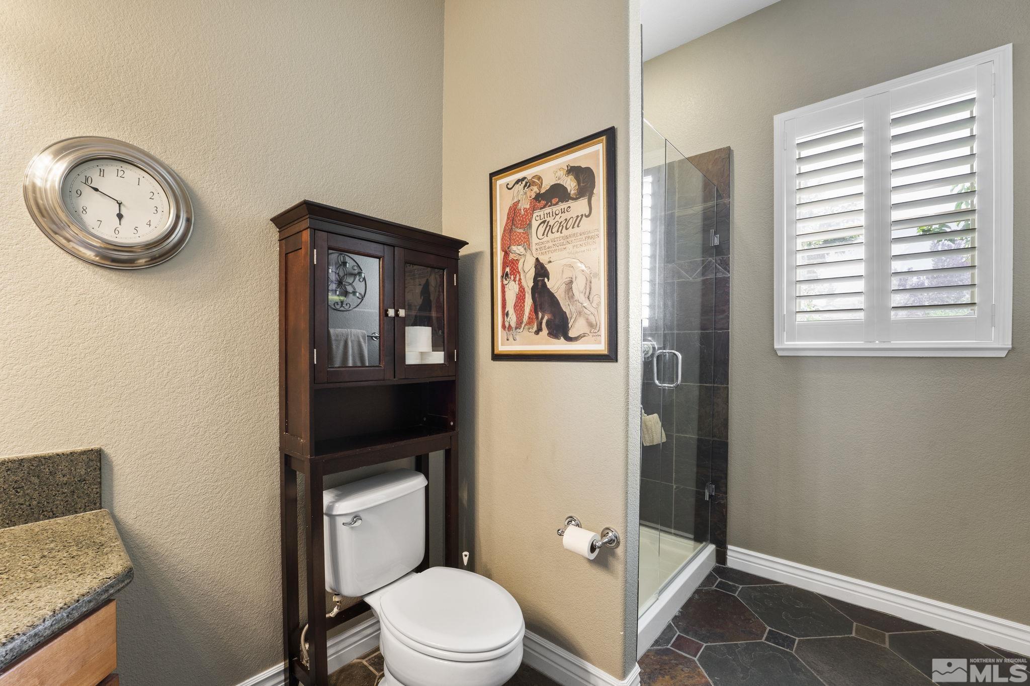 10080 Goler Wash Court Reno, NV 89521 - Photo 25 of 40 a white toilet sitting next to a bathroom sink