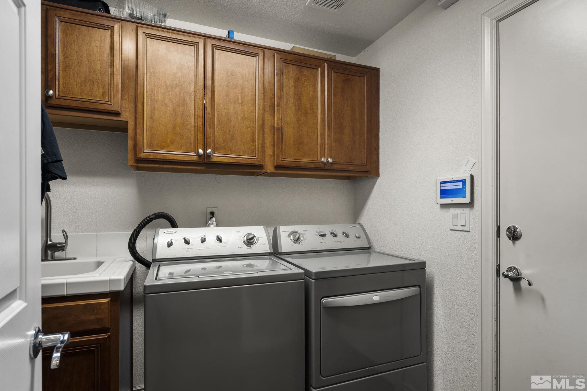 10080 Goler Wash Court Reno, NV 89521 - Photo 28 of 40 a utility room with dryer and washer