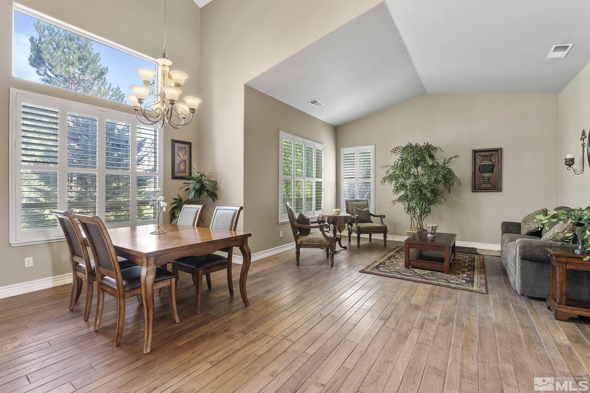 10080 Goler Wash Court Reno, NV 89521 - Photo 4 of 40 a view of a dining room with furniture window and wooden floor