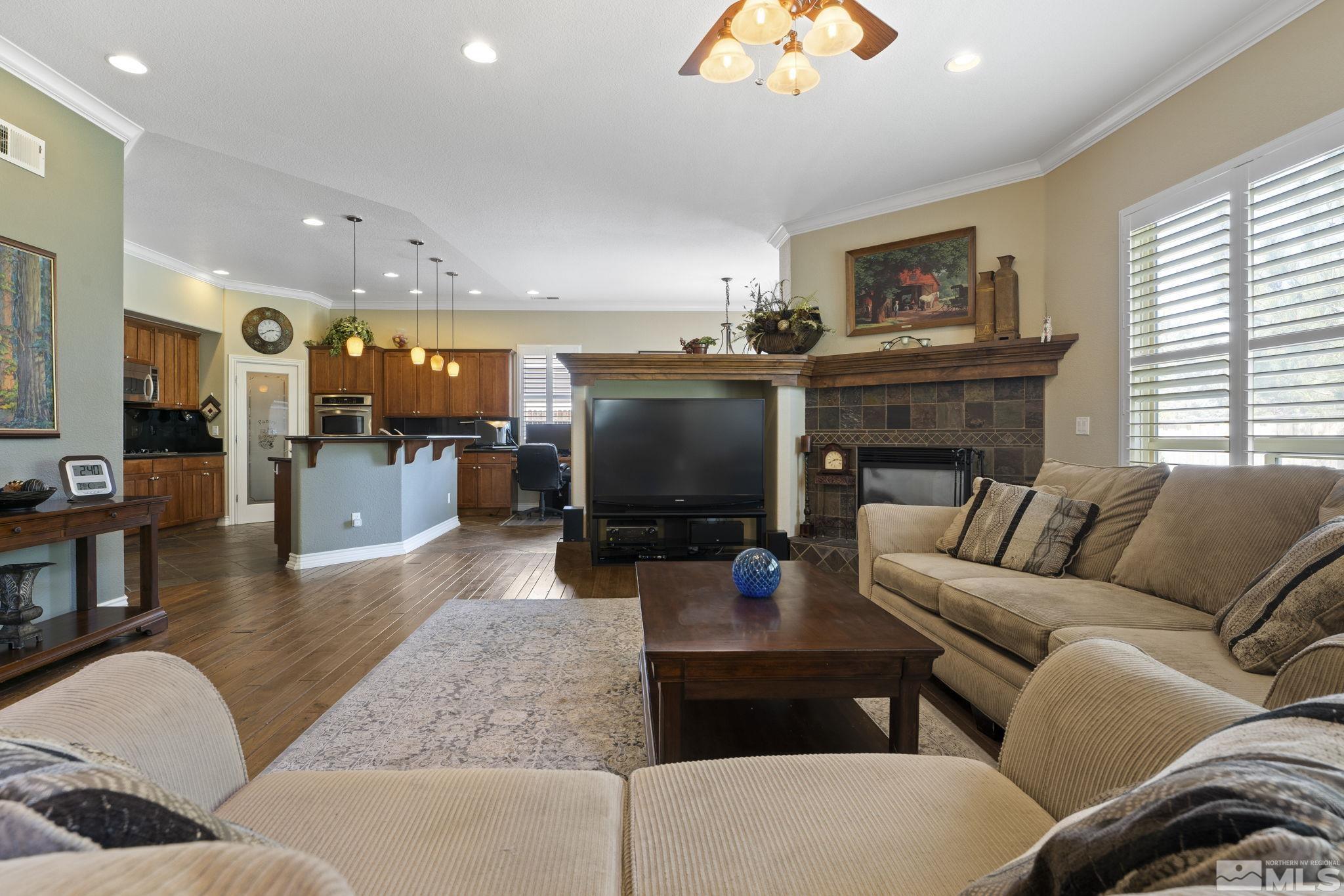 10080 Goler Wash Court Reno, NV 89521 - Photo 7 of 40 a living room with furniture and a flat screen tv