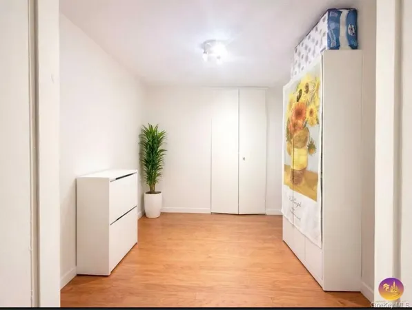 a view of an entryway with wooden floor