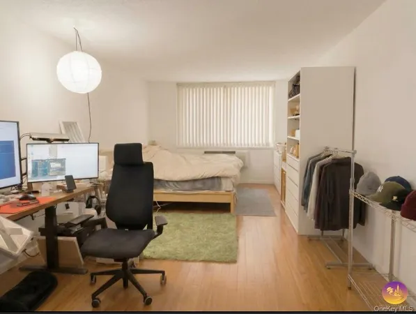 a workspace with furniture and wooden floor