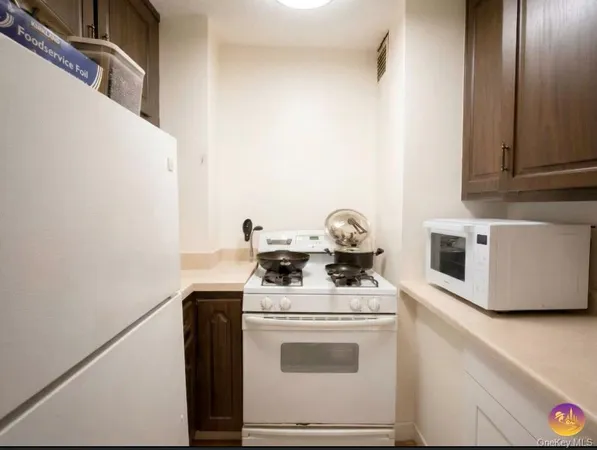 a view of washer and dryer with wooden floor