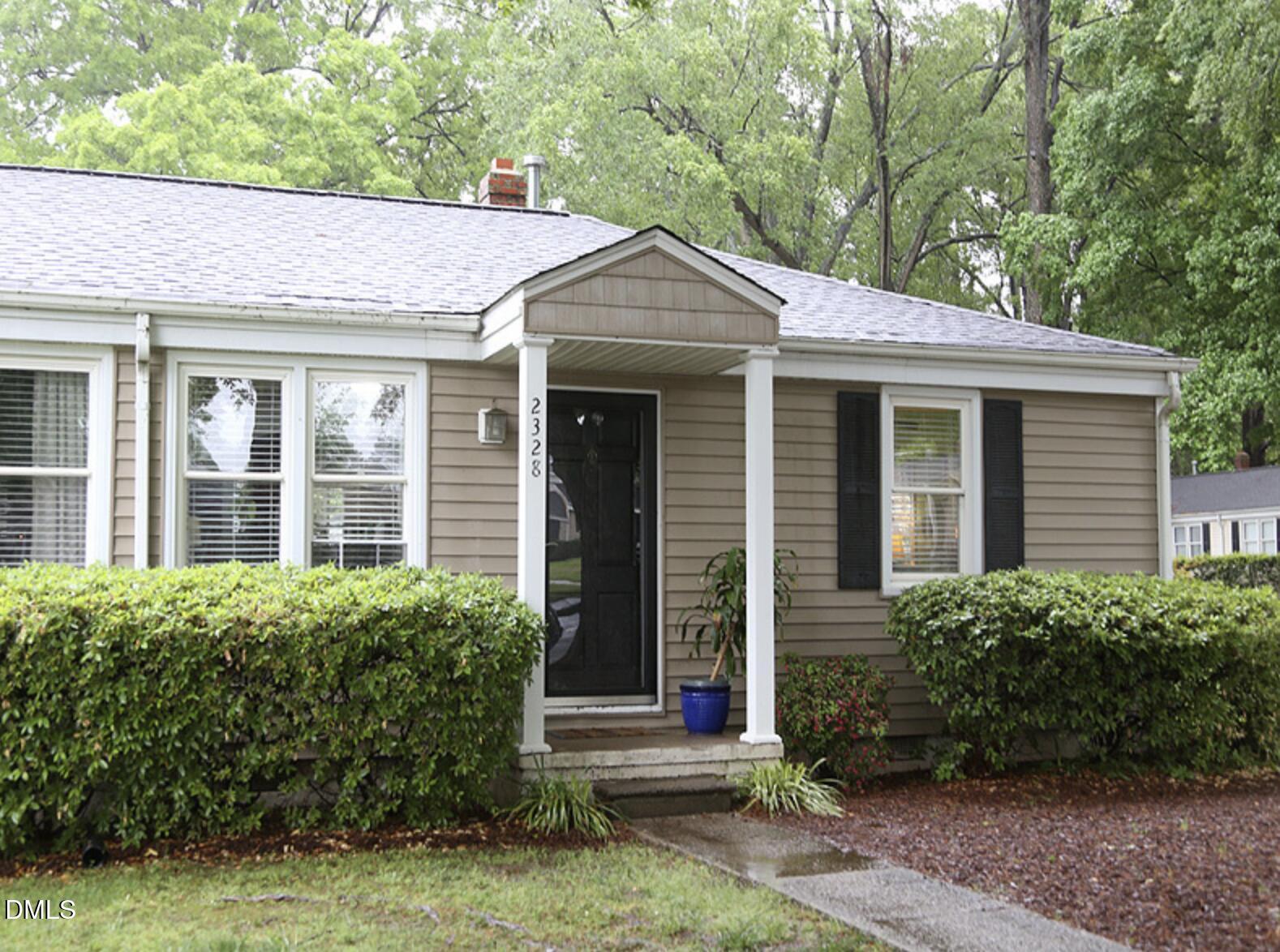 a view of a brick house with a large windows