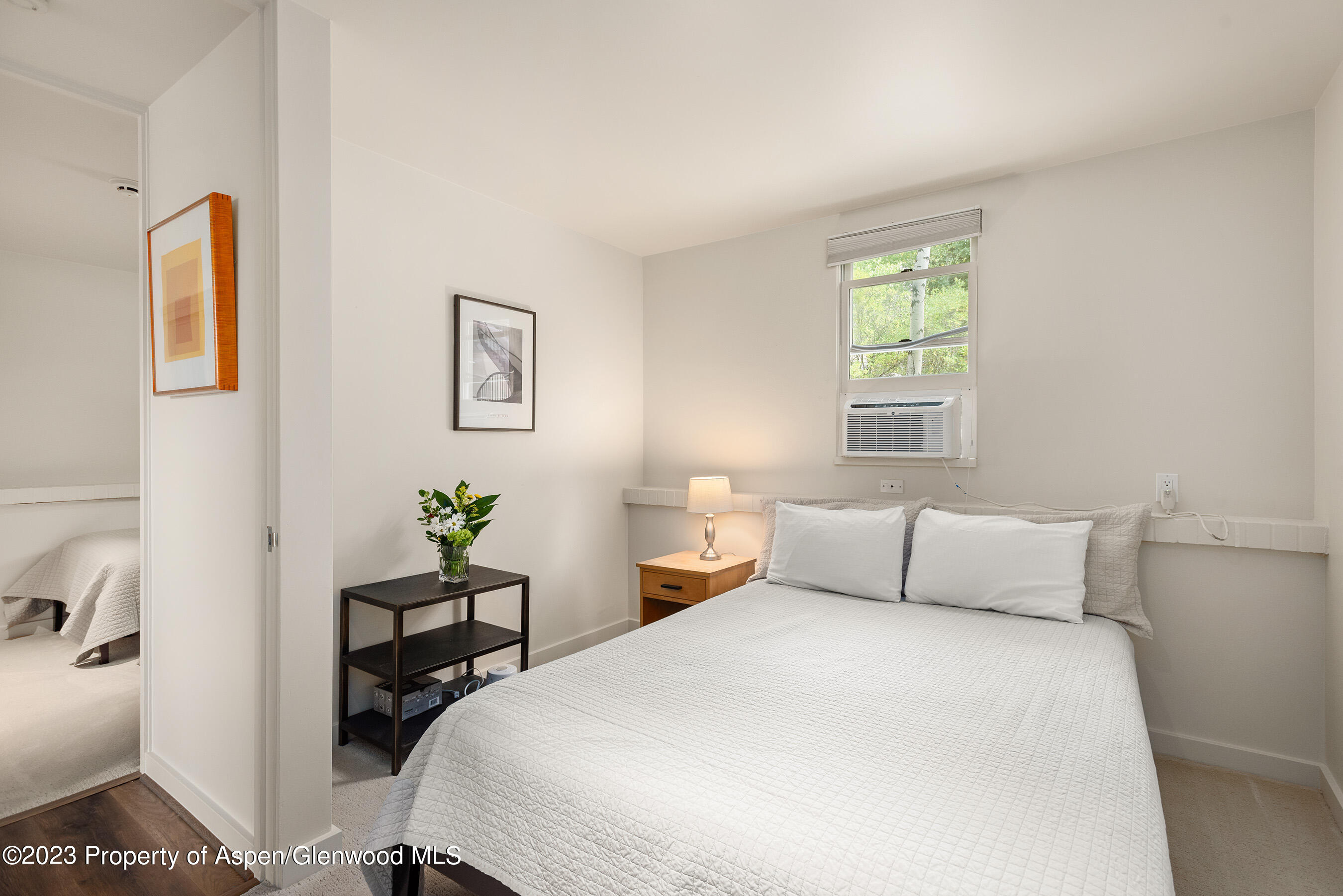 81 Meadows Trustee Road Aspen, CO 81611 - Photo 21 of 26 a bedroom with a bed and a window