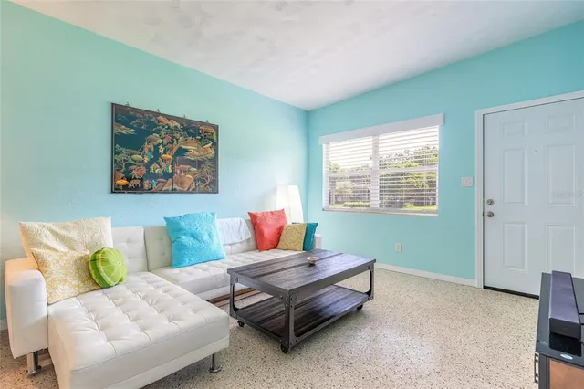 a living room with furniture and a window