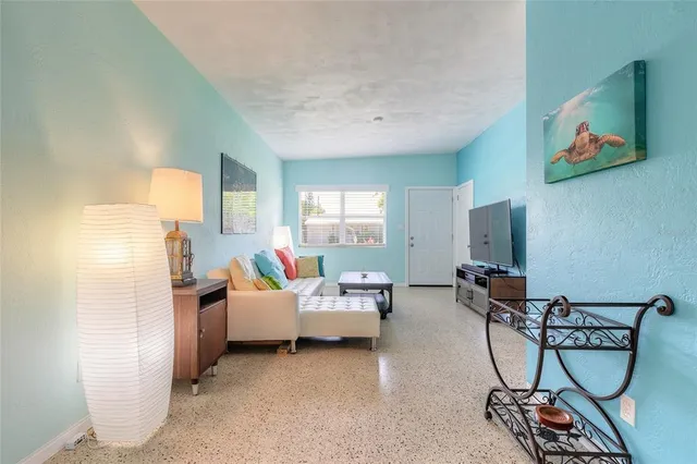 a living room with furniture and a window