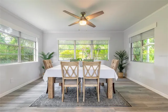 a dining room with furniture and window