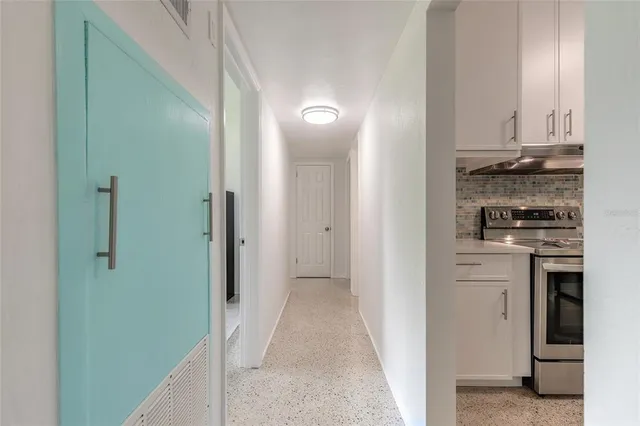 a view of a kitchen from the hallway