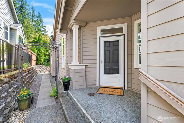 a view of the path along with potted plants