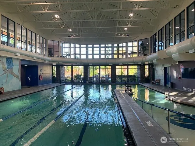 a view of a swimming pool with seating area