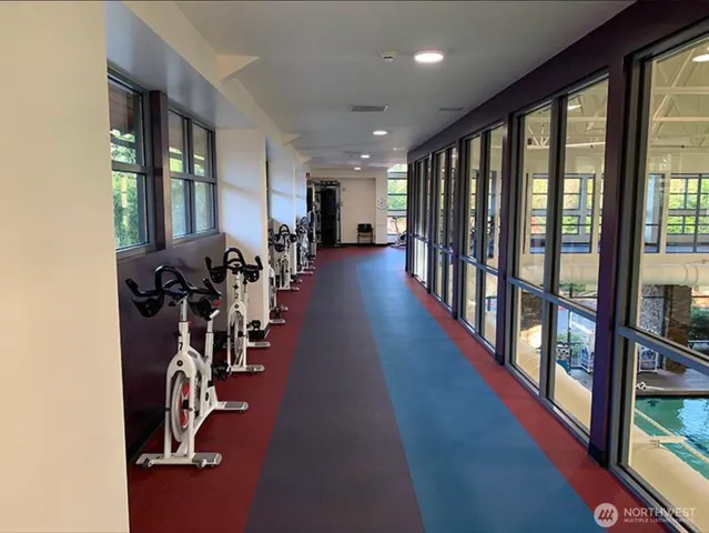 a living room with patio furniture and a fireplace