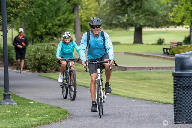 a room with pool table and windows
