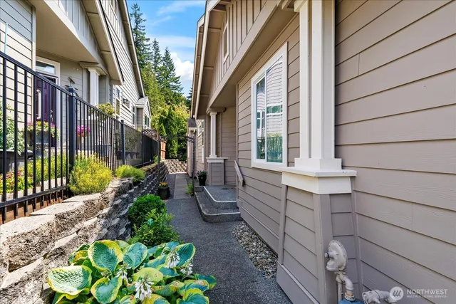 a view of a house with a chairs in a patio