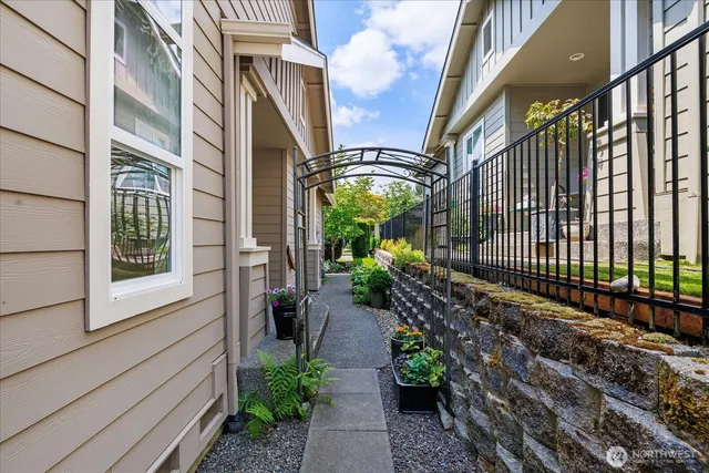 a view of a pathway with a backyard