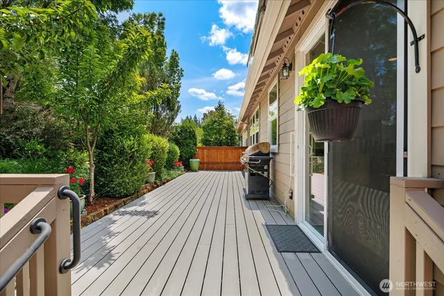 a view of balcony with wooden floor and potted plant