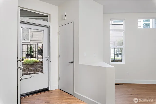 a kitchen with a refrigerator and a stove top oven