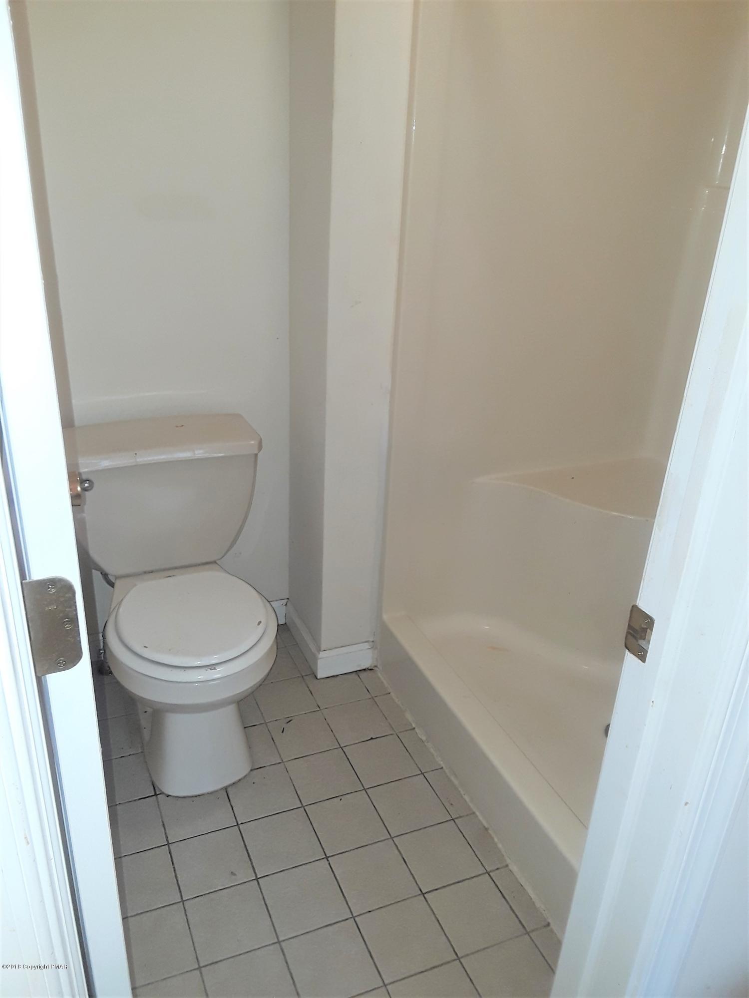 3105 Sequoia Road Tobyhanna, PA 18466 - Photo 18 of 29 a white toilet sitting next to a bath tub