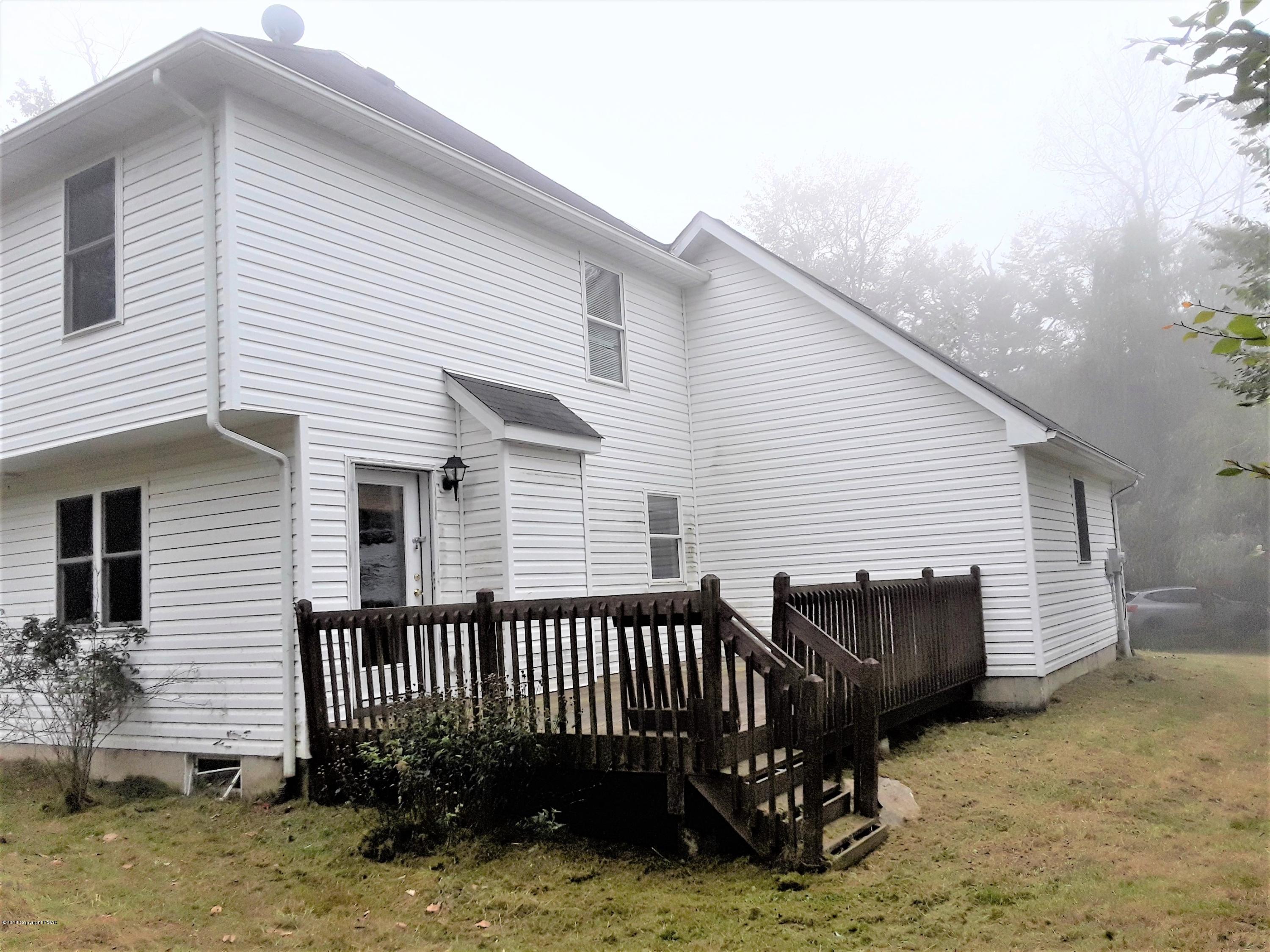 3105 Sequoia Road Tobyhanna, PA 18466 - Photo 28 of 29 a backyard of a house with a deck
