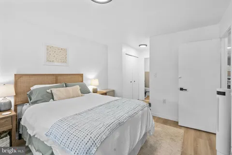 a bedroom with a bed and a walk in closet
