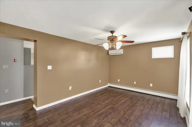 a view of room with wooden floor