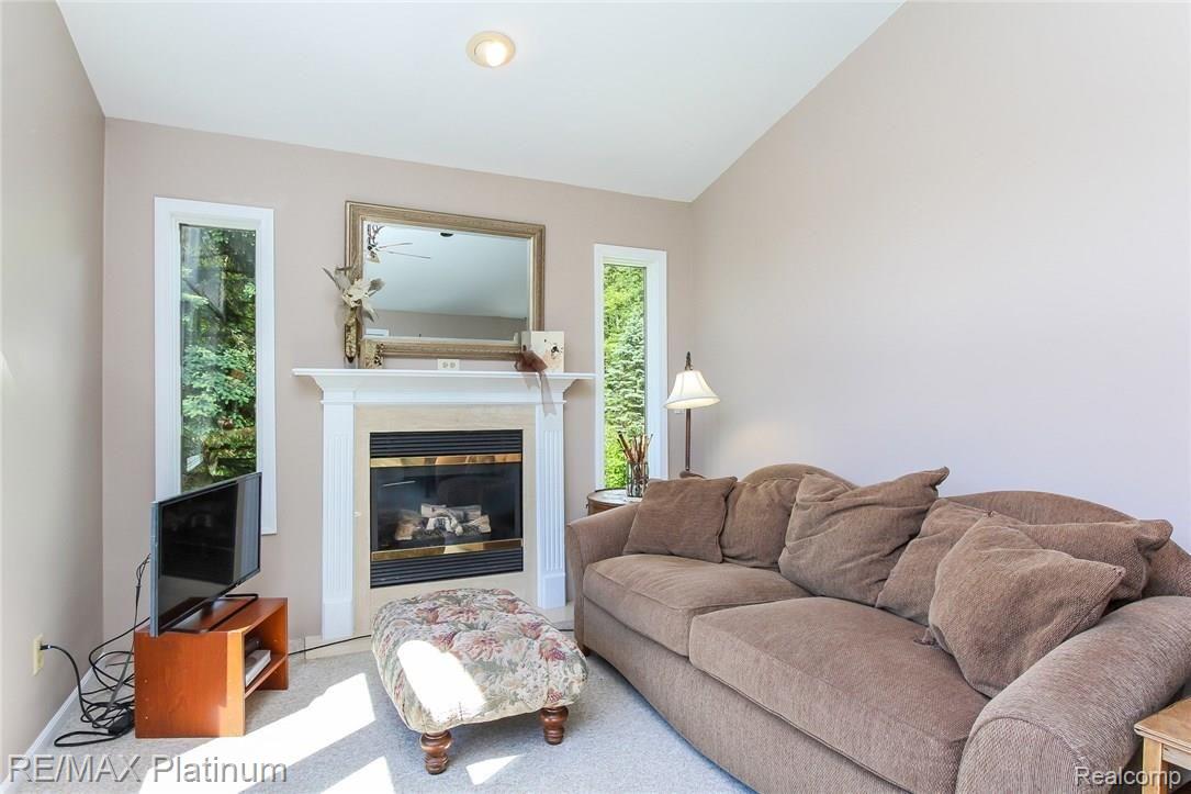 2445 Shehan Road Pinckney, MI 48169 - Photo 17 of 41 Private sitting area in Master with fireplace