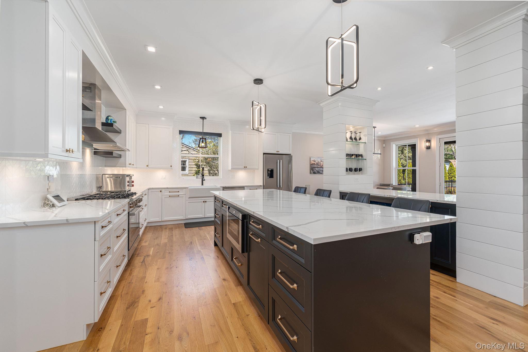 1665 Glenn Road Southold, NY 11971 - Photo 13 of 46 a kitchen with counter top space sink and center island